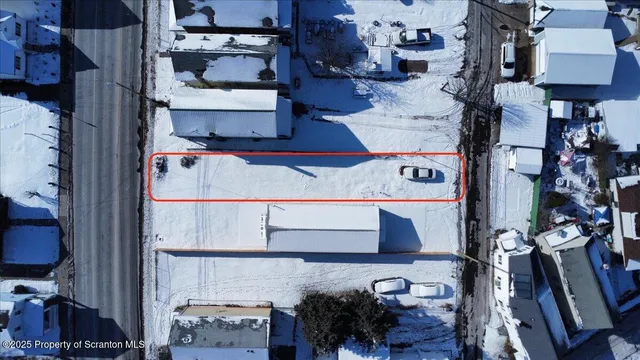 an aerial view of residential houses with parking space