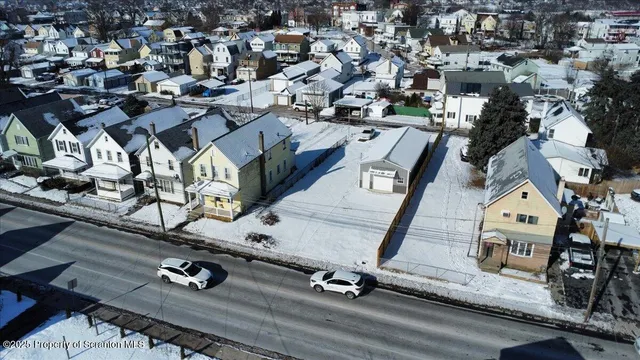 a view of a house with a yard and garage