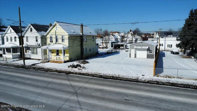 a view of a house with a snow