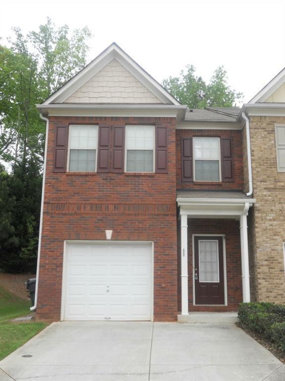 a front view of a house with a garage