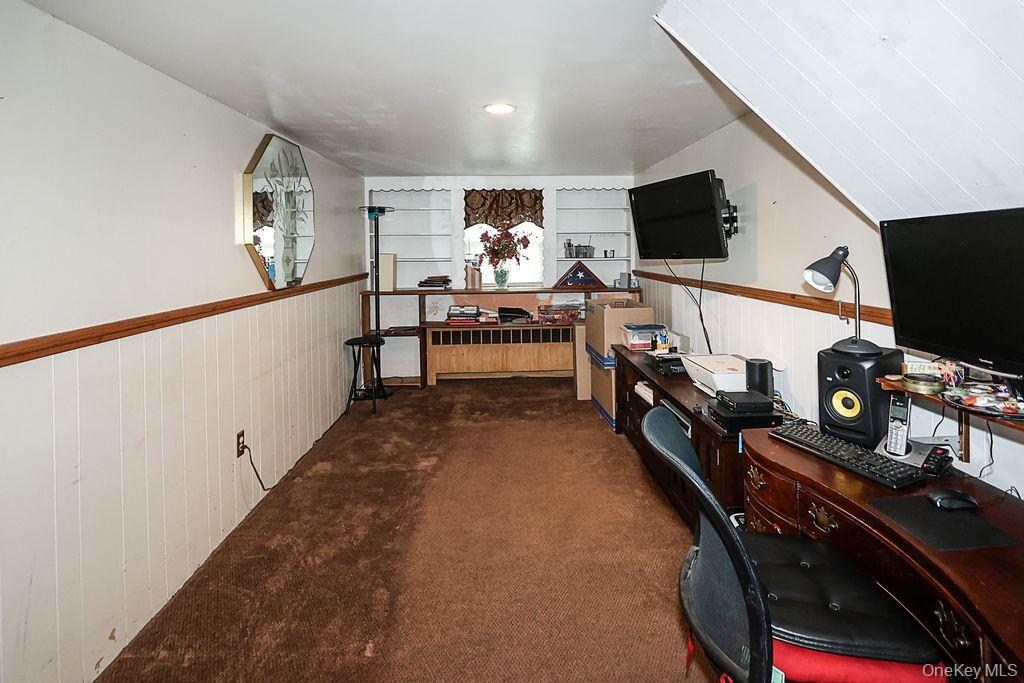 64 Conlon Road Roosevelt, NY 11575 - Photo 14 of 19 a living room with furniture and a flat screen tv