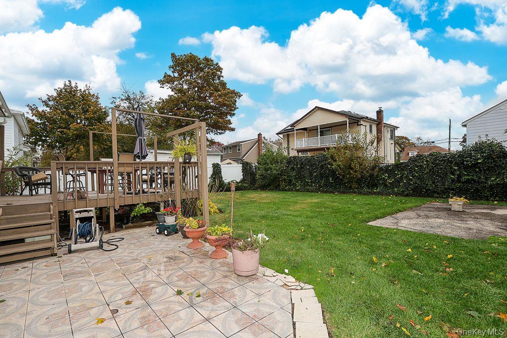 64 Conlon Road Roosevelt, NY 11575 - Photo 18 of 19 a view of a house with a yard