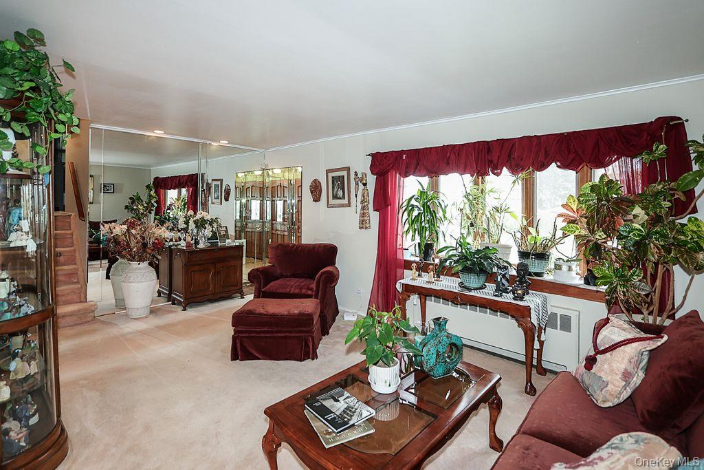 64 Conlon Road Roosevelt, NY 11575 - Photo 6 of 19 a living room with furniture and a large window