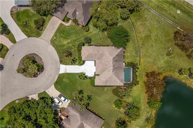 an aerial view of a house with outdoor space