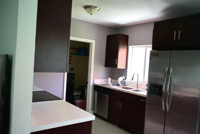 a bathroom with a sink vanity and mirror
