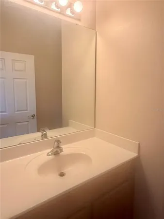 a bathroom with a sink and a shower