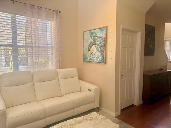 a living room with furniture and a window