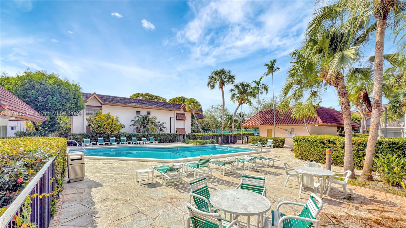 9302 Southwest 77th Avenue, Unit B1 Miami, FL 33156 - Photo 17 of 17 a view of swimming pool with outdoor seating and yard in back