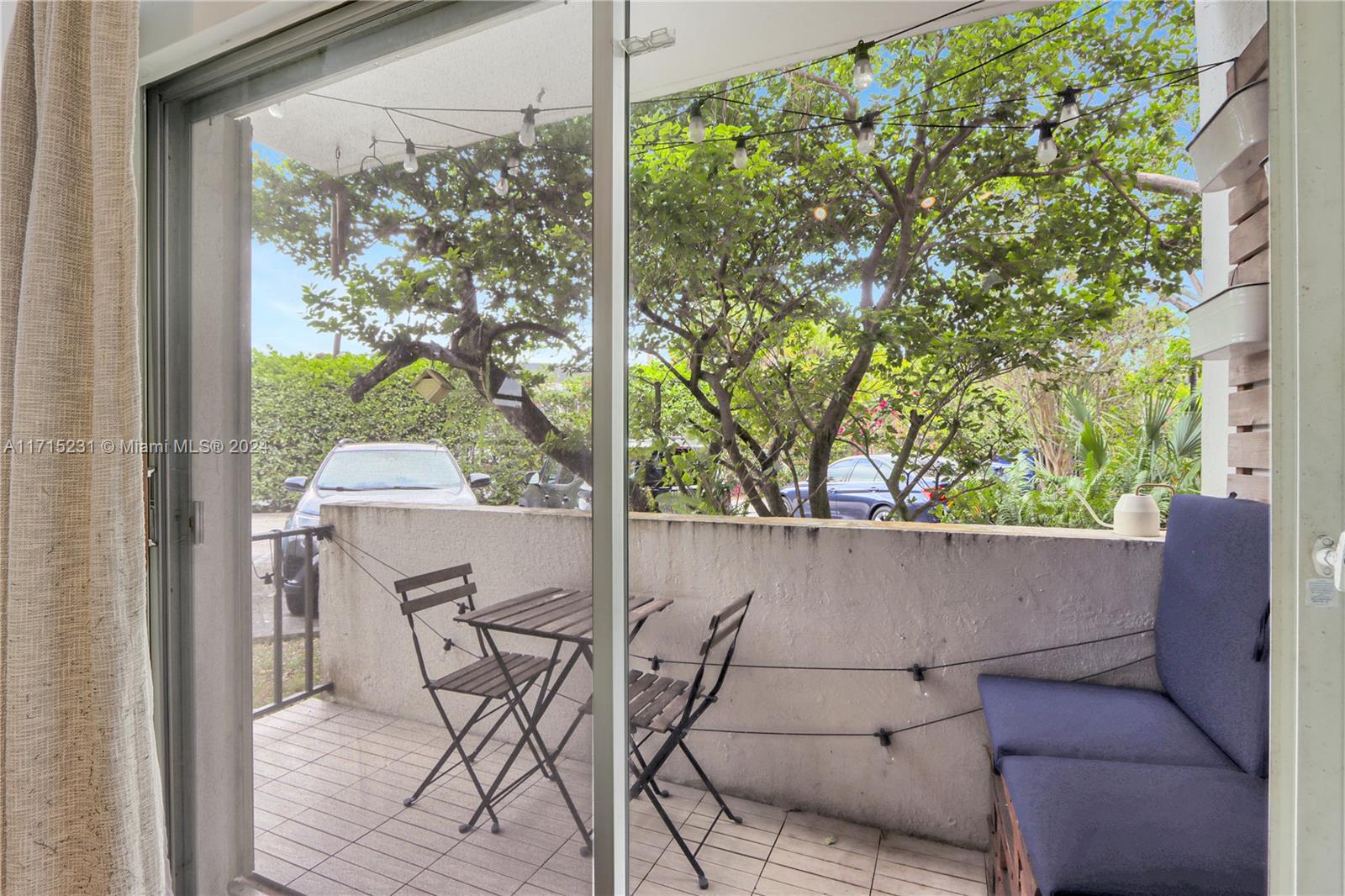 9302 Southwest 77th Avenue, Unit B1 Miami, FL 33156 - Photo 5 of 17 a view of backyard with a table and chairs