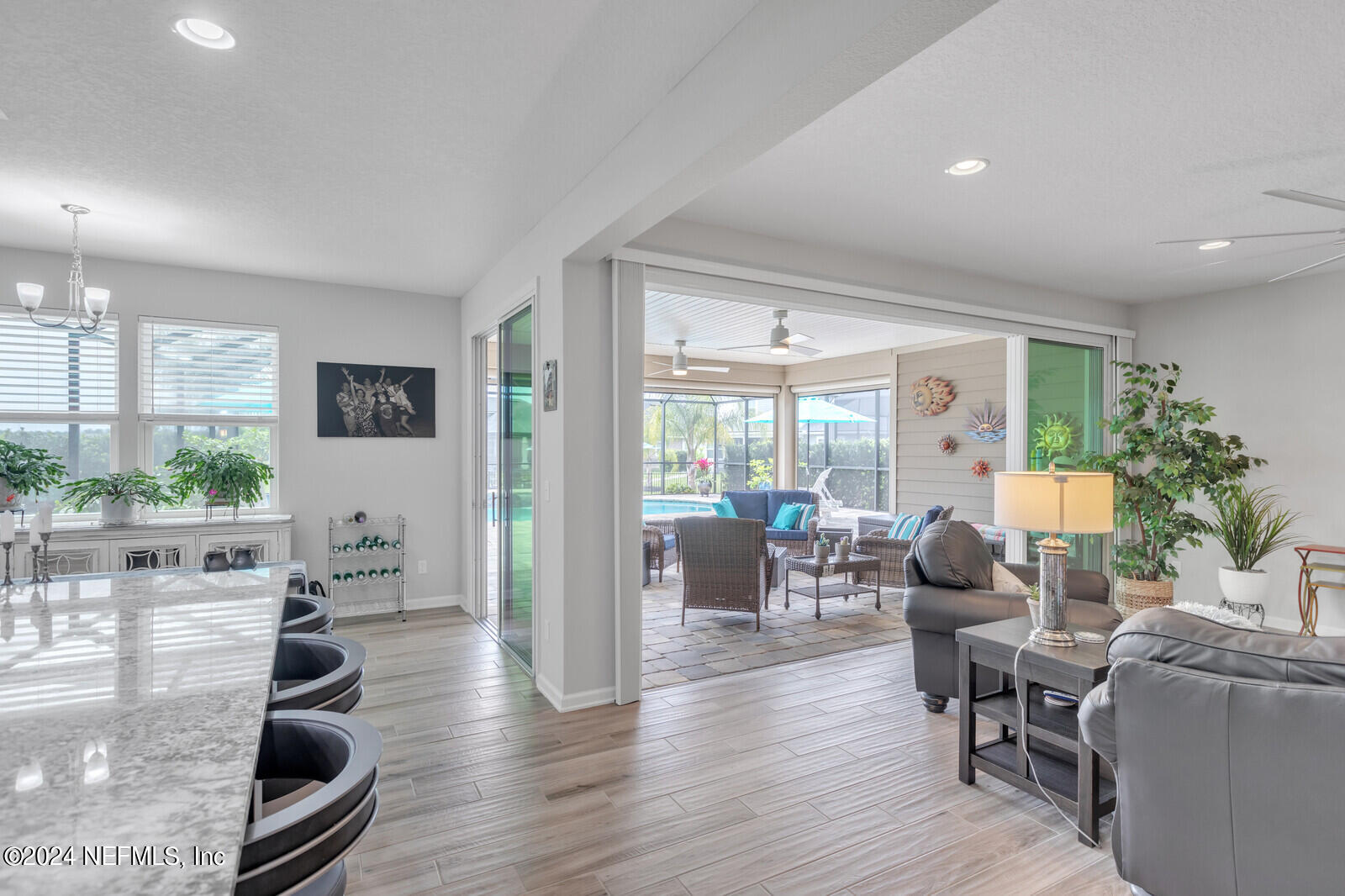 126 Firefly Trace St. Augustine, FL 32092 - Photo 16 of 54 a living room with furniture and a large window