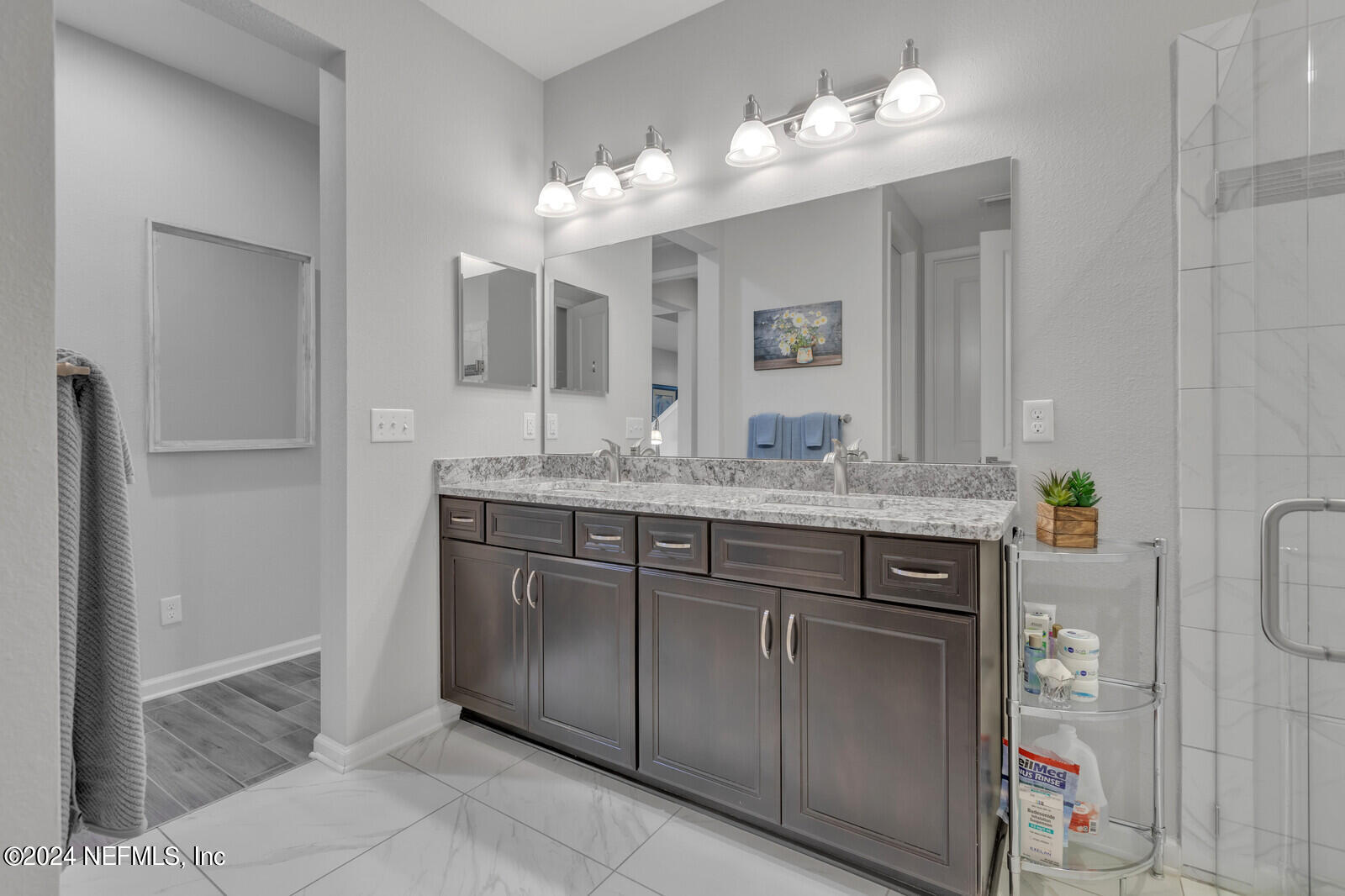 126 Firefly Trace St. Augustine, FL 32092 - Photo 22 of 54 a bathroom with a granite countertop sink and a mirror