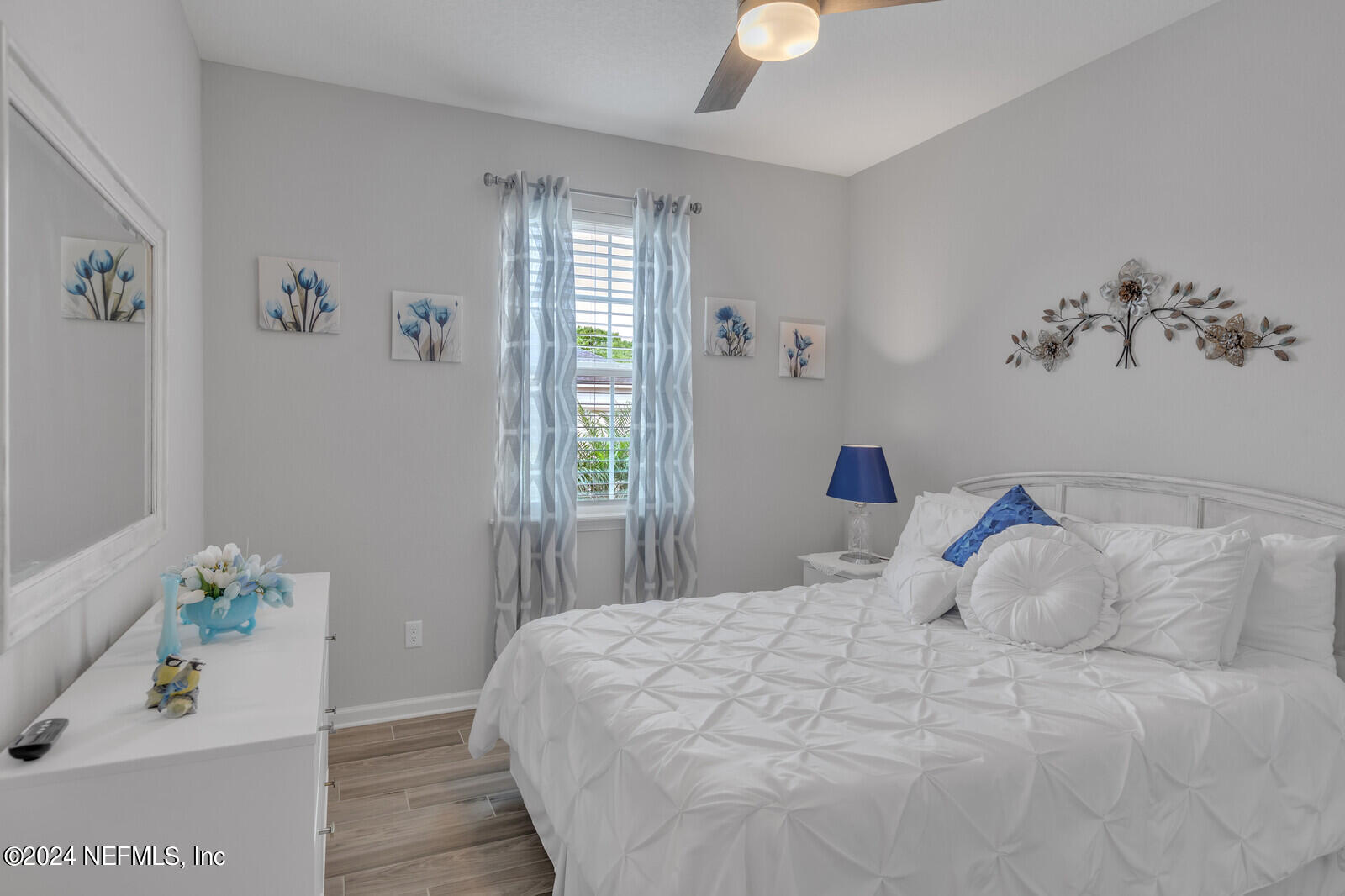 126 Firefly Trace St. Augustine, FL 32092 - Photo 24 of 54 a bedroom with a bed and a window