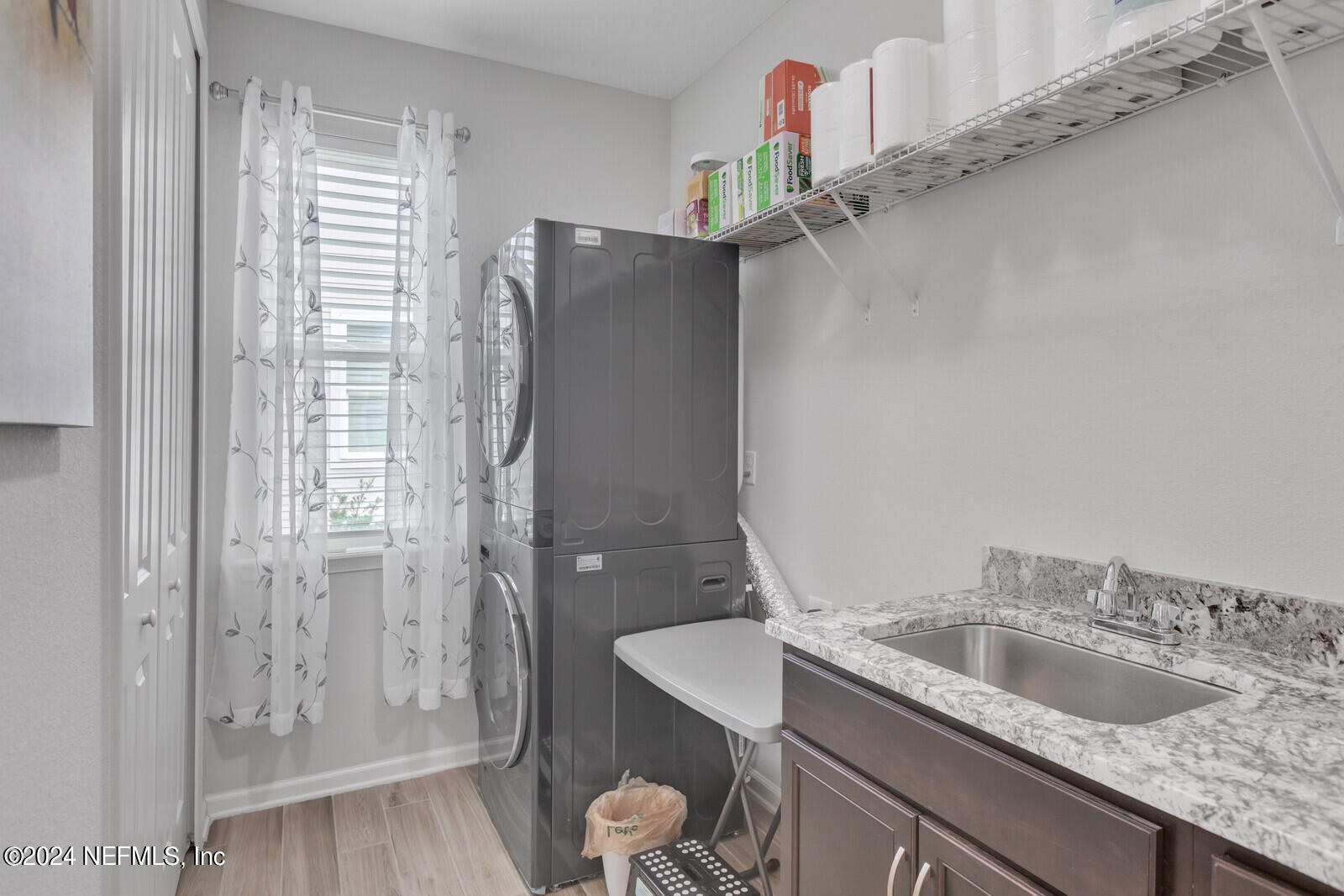 126 Firefly Trace St. Augustine, FL 32092 - Photo 26 of 54 a bathroom with a granite countertop sink a toilet and shower