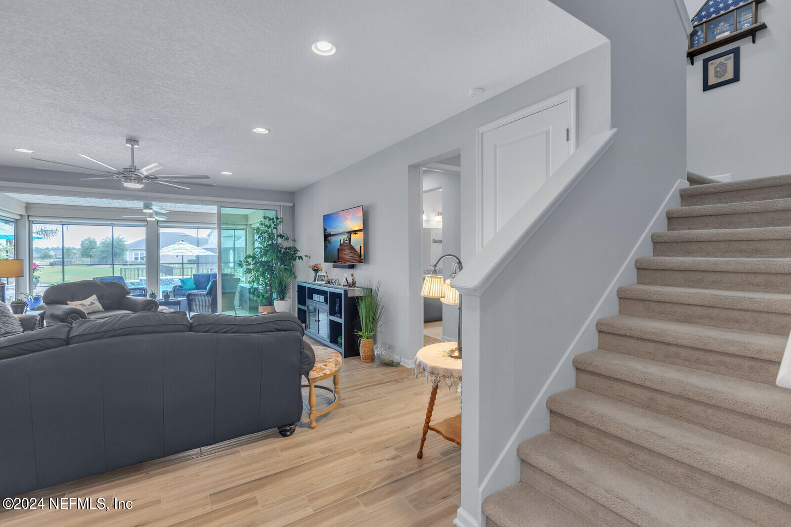 126 Firefly Trace St. Augustine, FL 32092 - Photo 27 of 54 a living room with furniture and a large window
