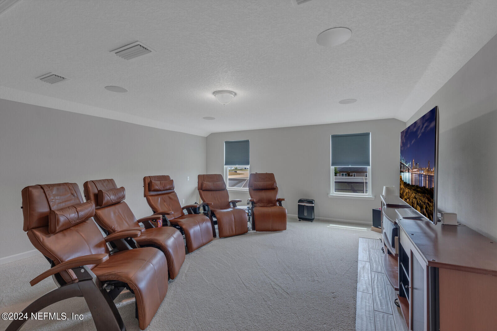 126 Firefly Trace St. Augustine, FL 32092 - Photo 28 of 54 a bed room with furniture and a flat screen tv