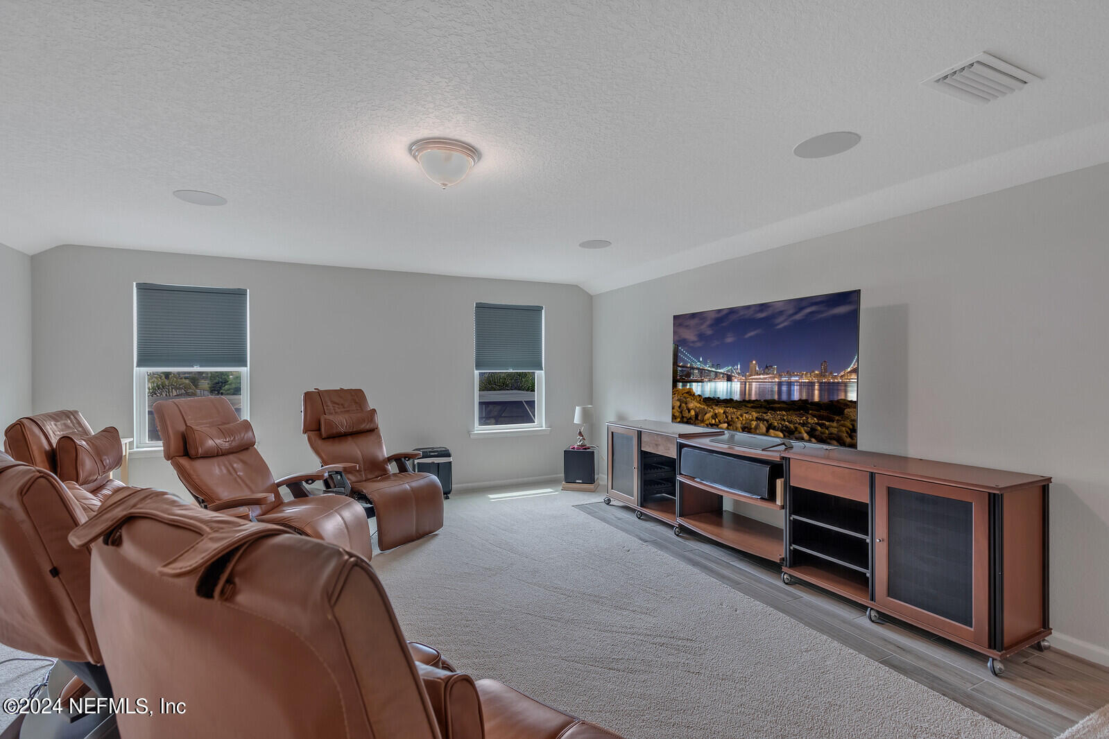 126 Firefly Trace St. Augustine, FL 32092 - Photo 29 of 54 a living room with furniture a flat screen tv and gym equipment