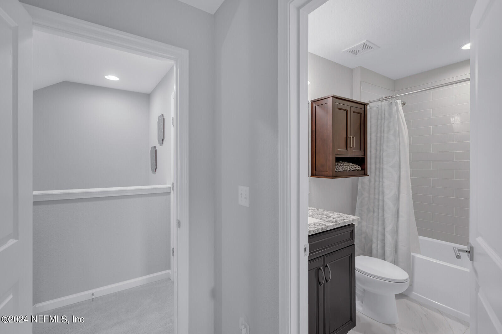 126 Firefly Trace St. Augustine, FL 32092 - Photo 31 of 54 a bathroom with a granite countertop toilet and a sink