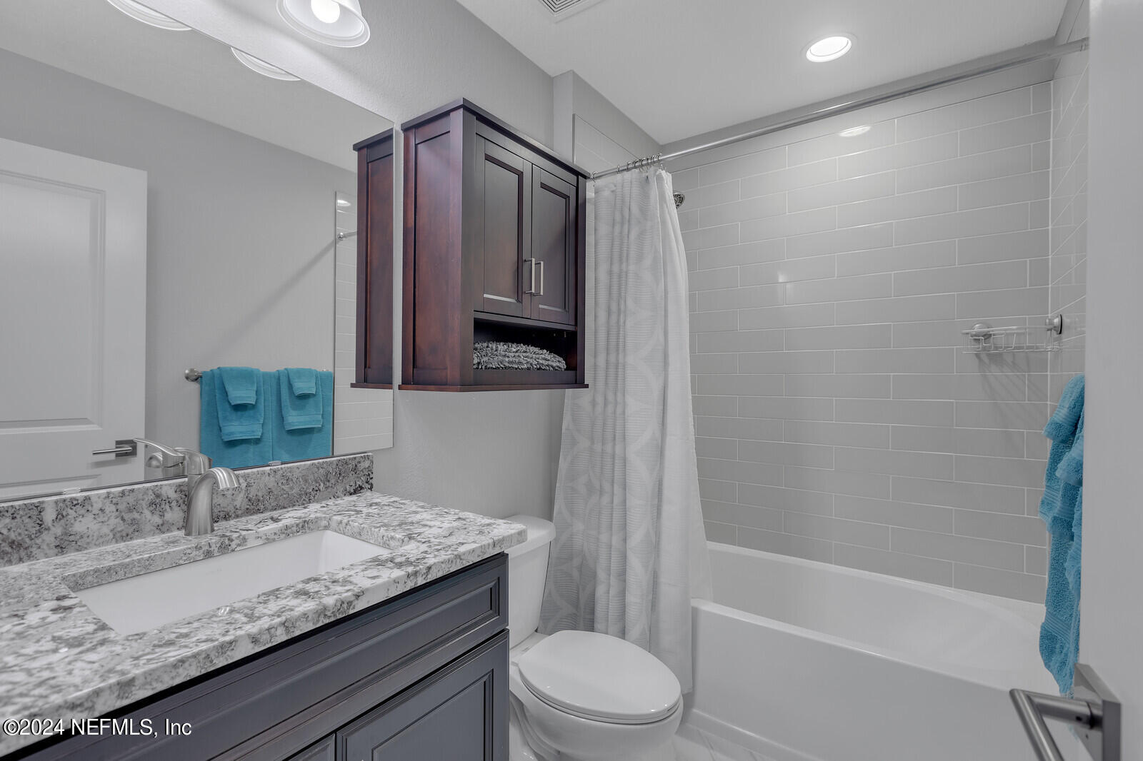 126 Firefly Trace St. Augustine, FL 32092 - Photo 32 of 54 a bathroom with a granite countertop sink toilet and shower