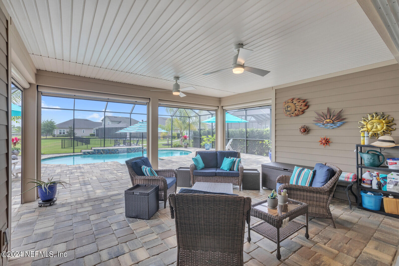 126 Firefly Trace St. Augustine, FL 32092 - Photo 33 of 54 a living room with furniture and a floor to ceiling window