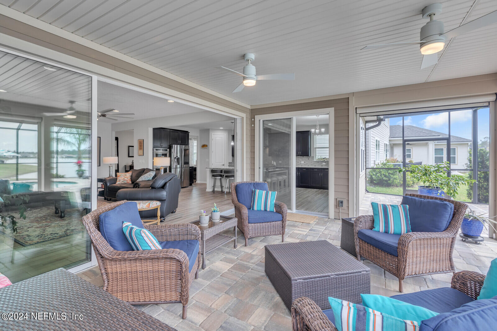 126 Firefly Trace St. Augustine, FL 32092 - Photo 34 of 54 a living room with furniture and a large window