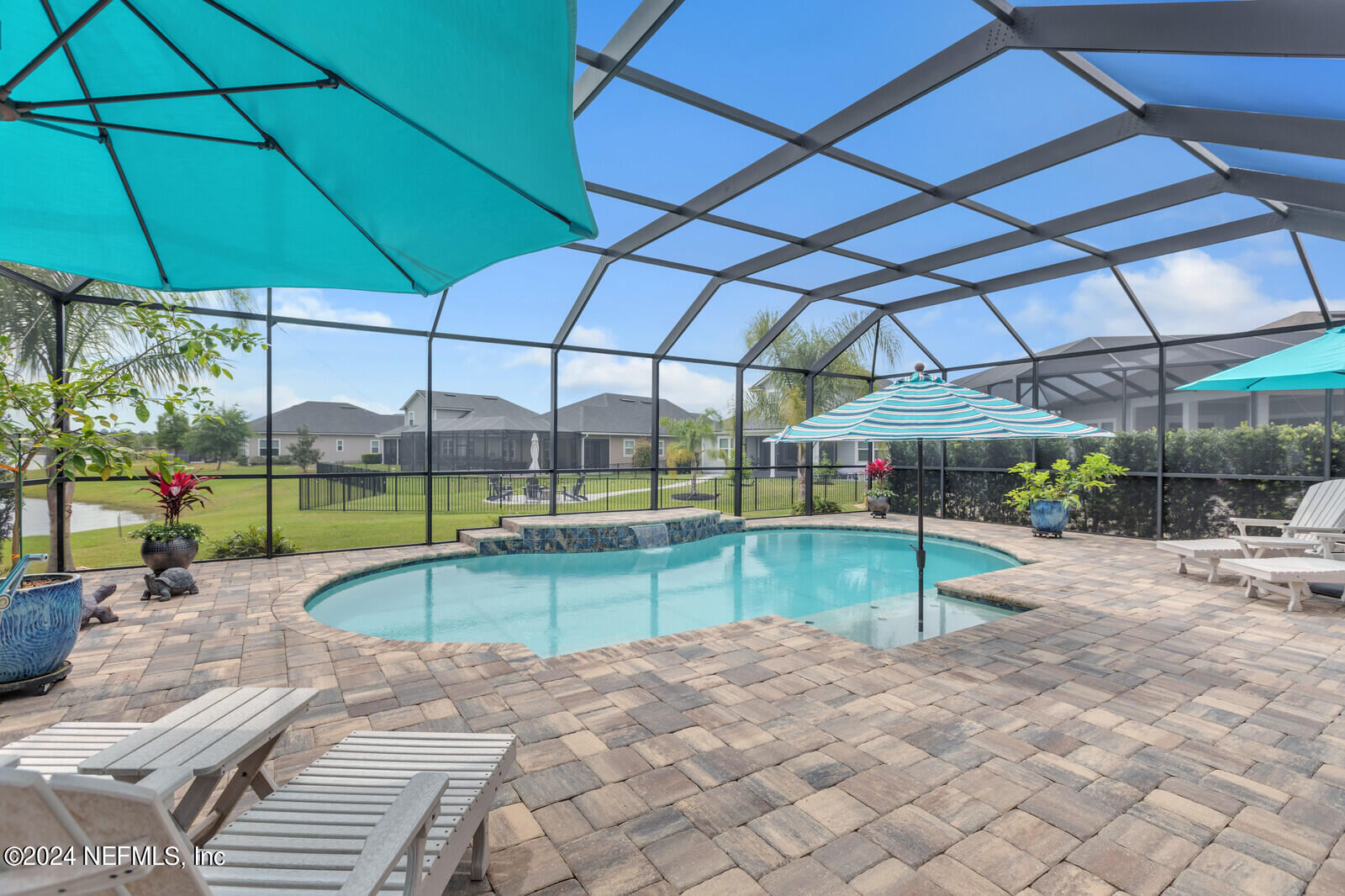 126 Firefly Trace St. Augustine, FL 32092 - Photo 35 of 54 a view of a backyard with swimming pool