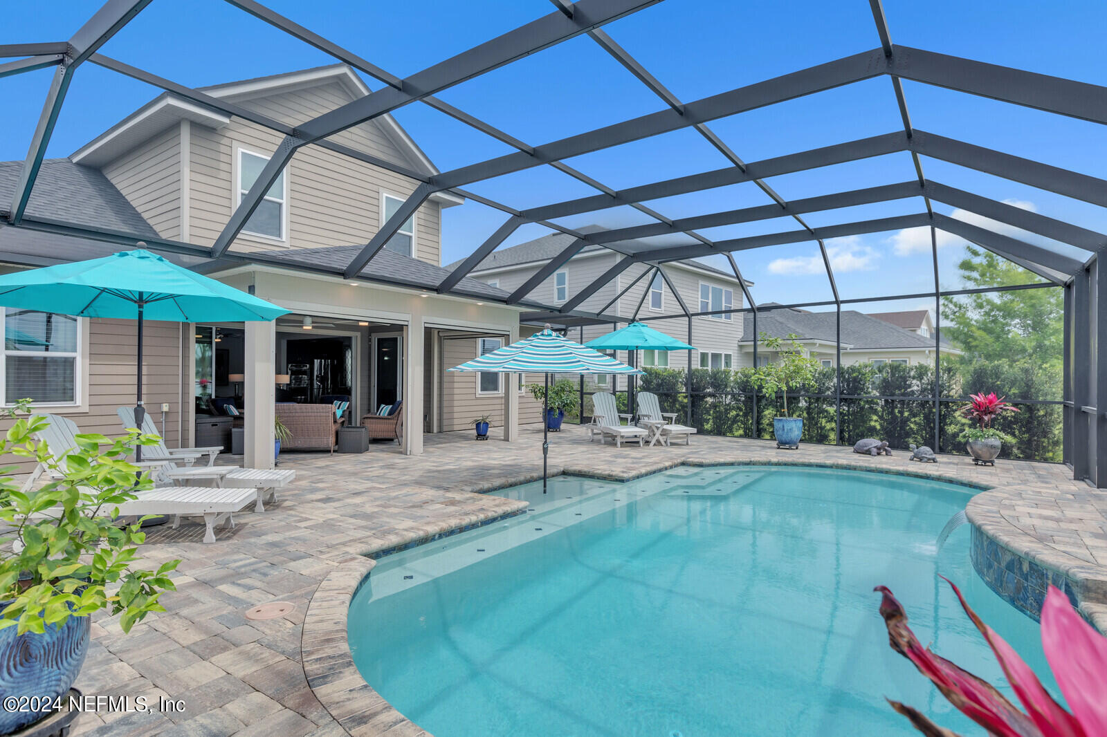 126 Firefly Trace St. Augustine, FL 32092 - Photo 36 of 54 a view of a backyard with sitting area