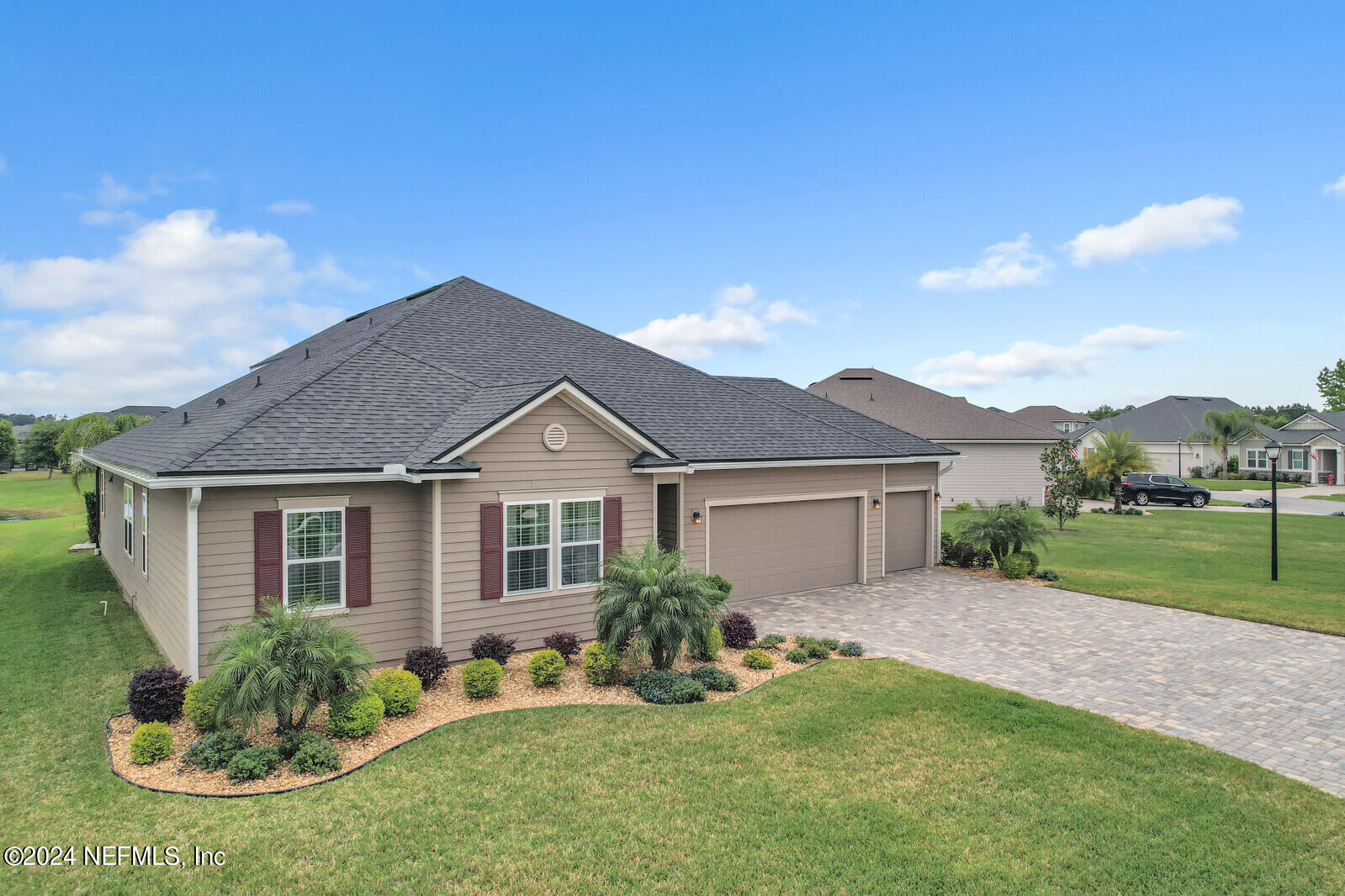 126 Firefly Trace St. Augustine, FL 32092 - Photo 4 of 54 a front view of a house with a yard