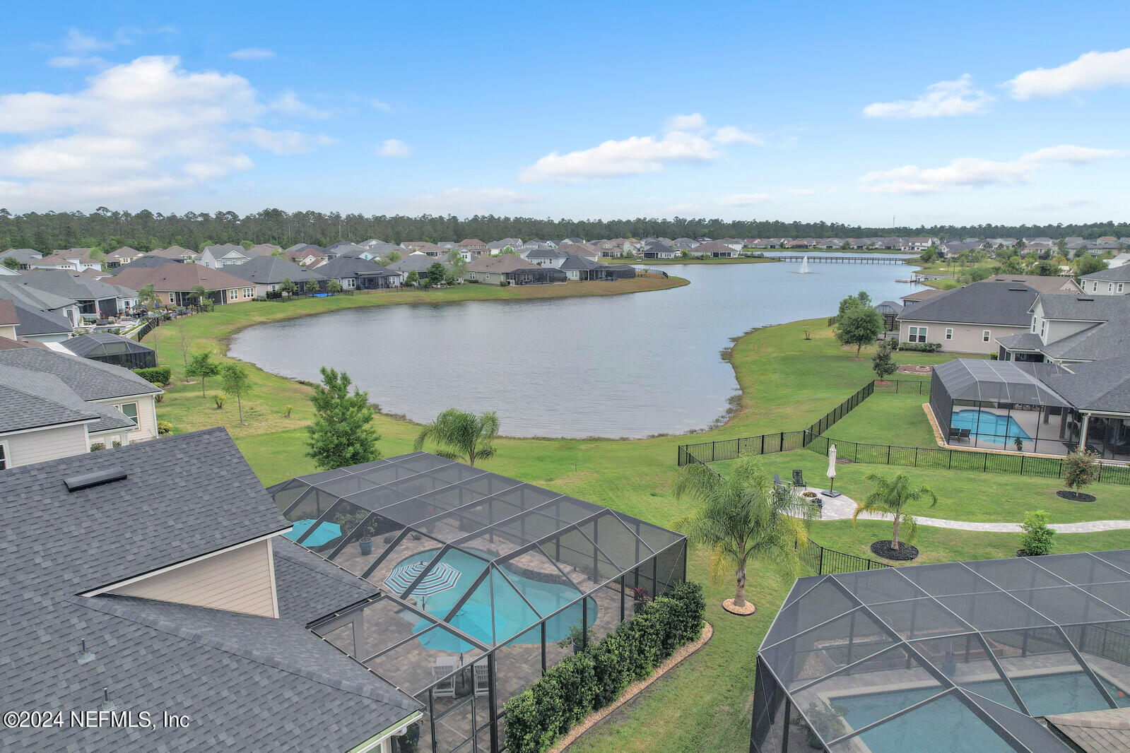 126 Firefly Trace St. Augustine, FL 32092 - Photo 41 of 54 an aerial view of a house with outdoor space and lake view in back