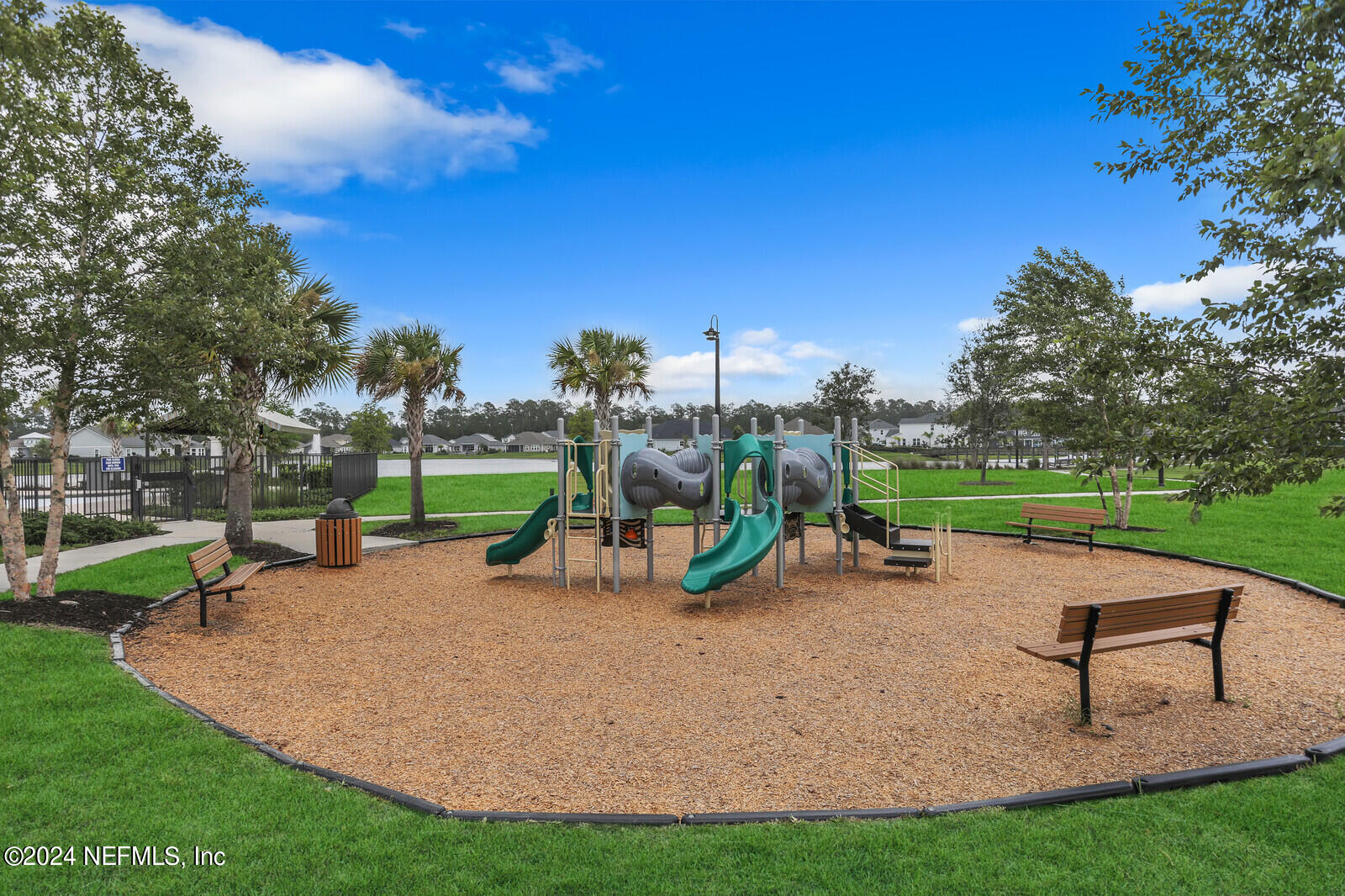 126 Firefly Trace St. Augustine, FL 32092 - Photo 52 of 54 a view of a park with swings and slides