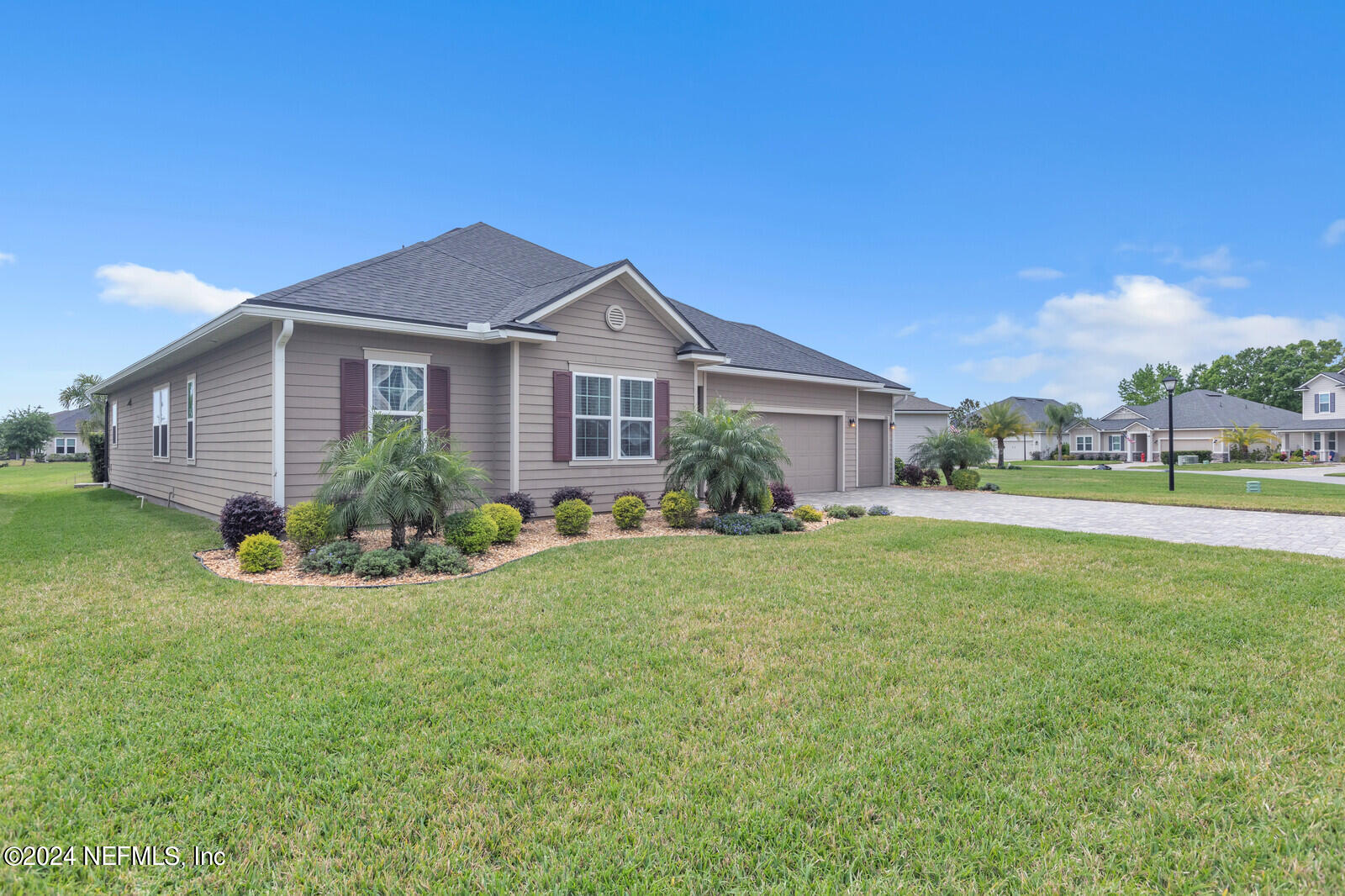 126 Firefly Trace St. Augustine, FL 32092 - Photo 6 of 54 a front view of house with yard and green space