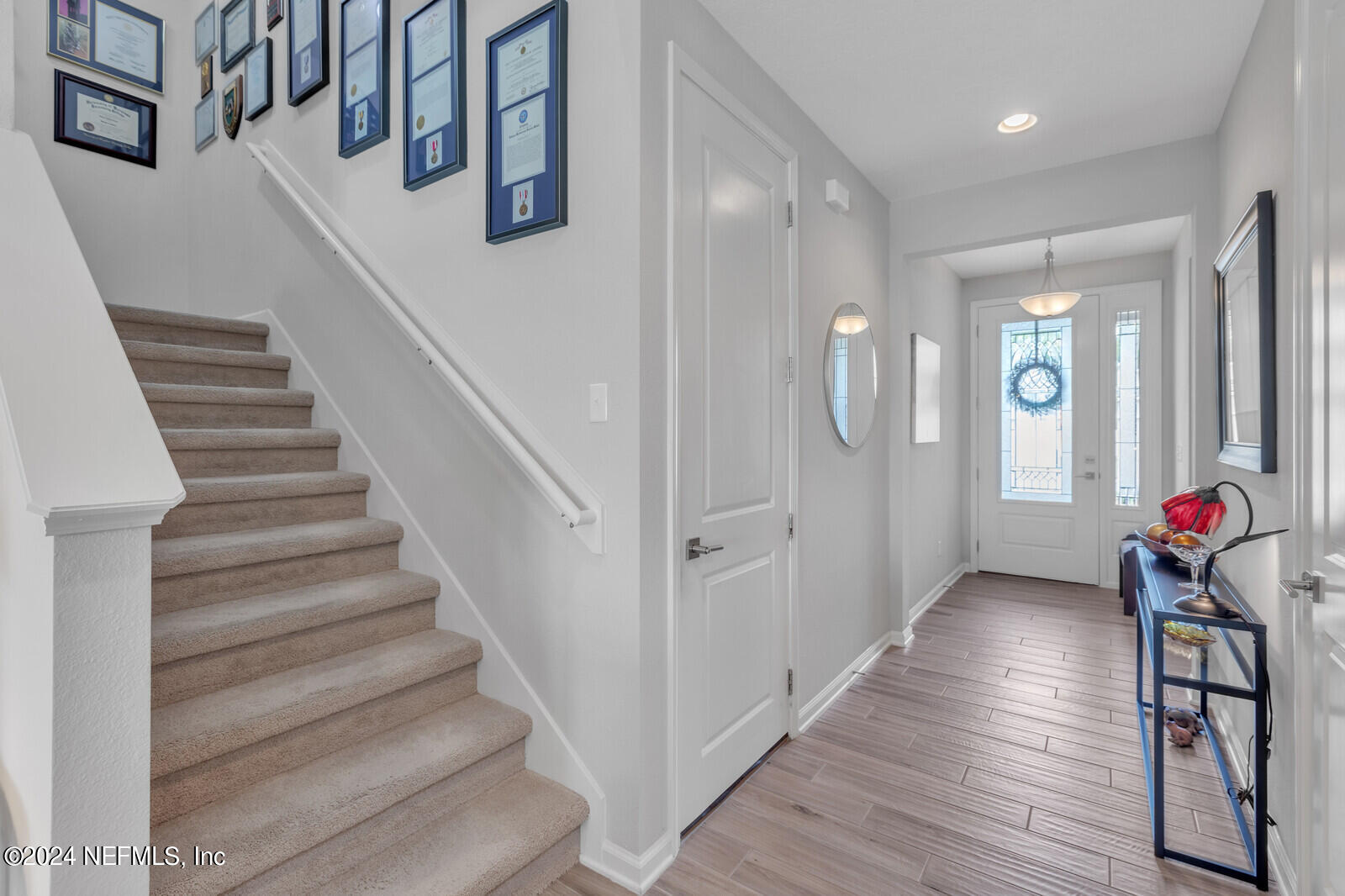 126 Firefly Trace St. Augustine, FL 32092 - Photo 7 of 54 a view of entryway and hall with wooden floor
