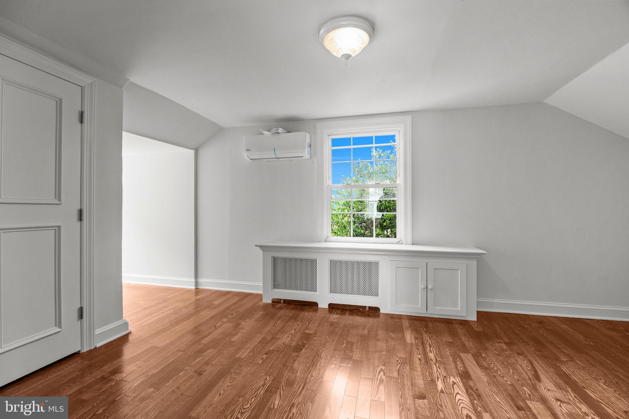 182 West Upper Ferry Road Ewing, NJ 08628 - Photo 22 of 33 an empty room with wooden floor and windows