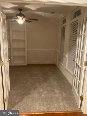 a view of room with a ceiling fan