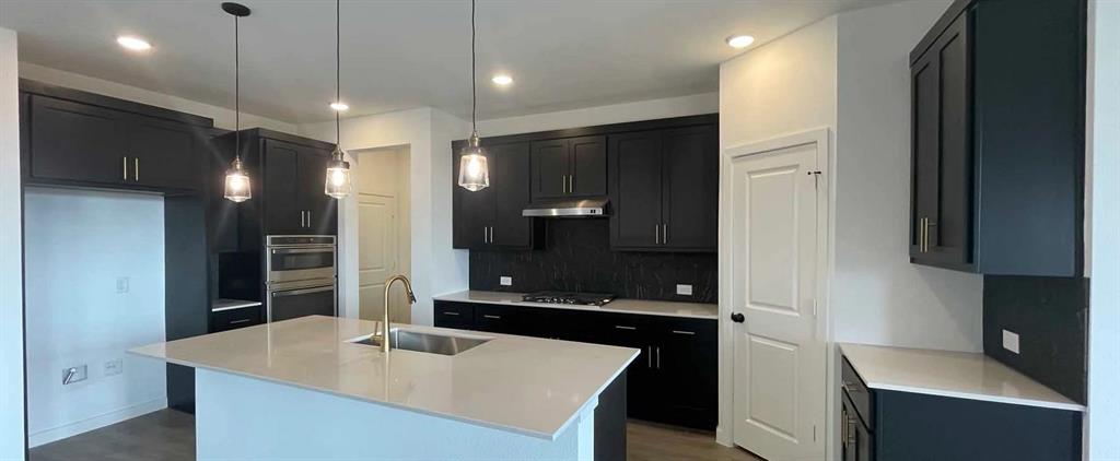 1612 Abbott Crk Road Celina, TX 75009 - Photo 17 of 34 Kitchen Construction Progress featuring the Noir Collection