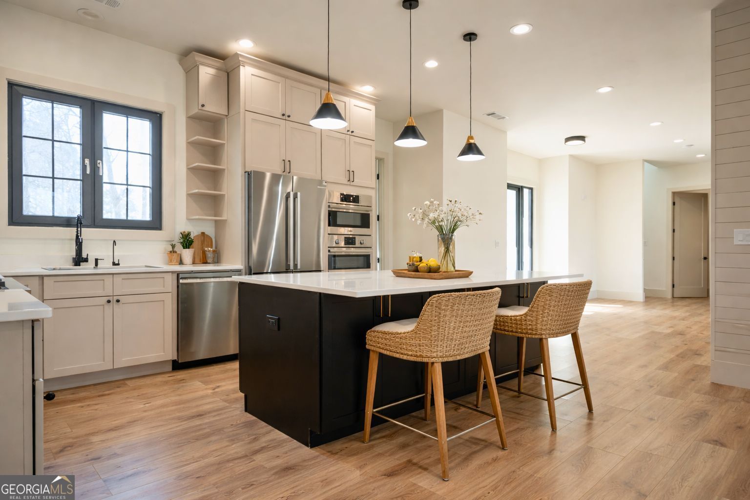 1170 Mulberry Chase Commerce, GA 30530 - Photo 4 of 11 a kitchen with a table chairs sink and cabinets