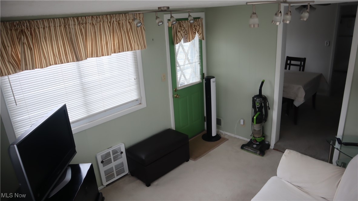 4213 Stonehaven Road Cleveland, OH 44121 - Photo 4 of 21 Carpeted living area with baseboards
