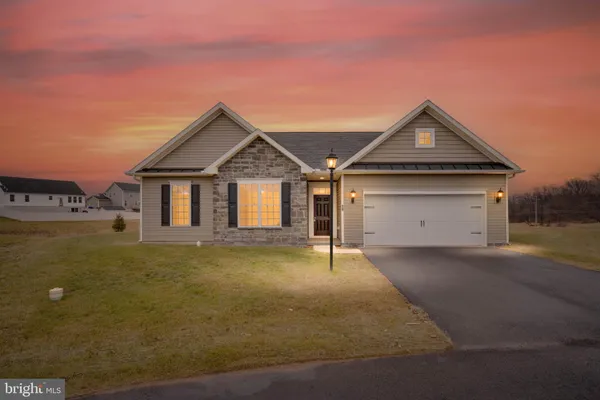 a front view of a house with yard