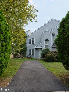 99 Carousel Circle Doylestown, PA 18901 - Photo 1 of 14 a front view of a house with a garden