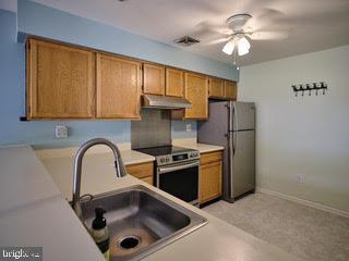 99 Carousel Circle Doylestown, PA 18901 - Photo 6 of 14 a kitchen with stainless steel appliances granite countertop a sink a refrigerator and a stove