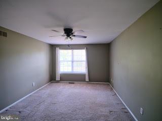 99 Carousel Circle Doylestown, PA 18901 - Photo 10 of 14 a view of room with a ceiling fan and window