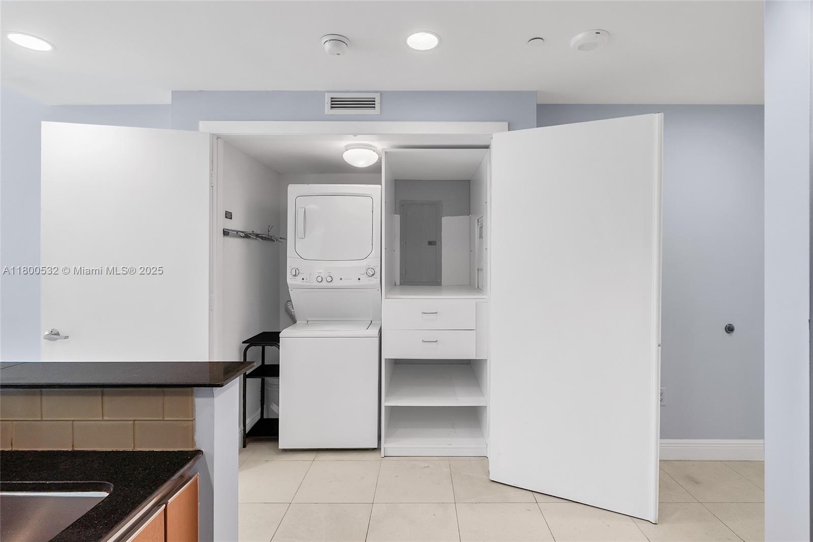 1060 Brickell Avenue, Unit 1811 Miami, FL 33131 - Photo 12 of 43 a kitchen with a refrigerator and a stove