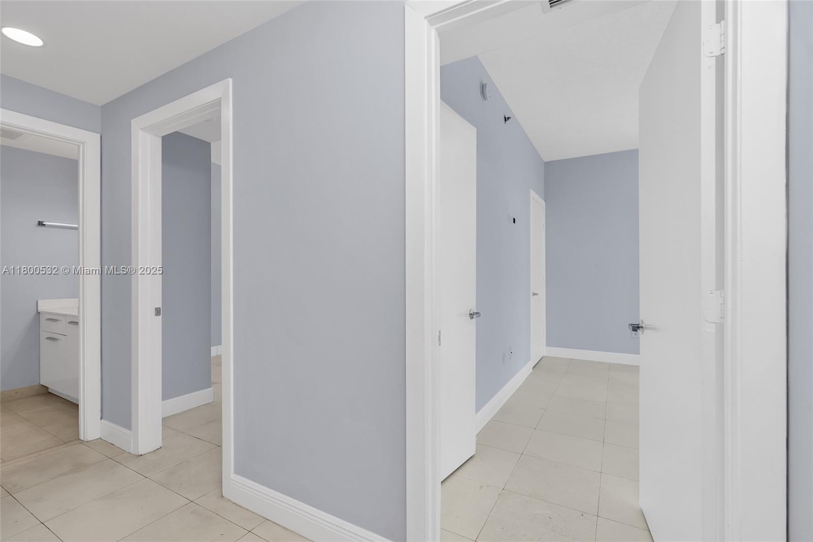1060 Brickell Avenue, Unit 1811 Miami, FL 33131 - Photo 24 of 43 a view of a hallway with closet and bathroom