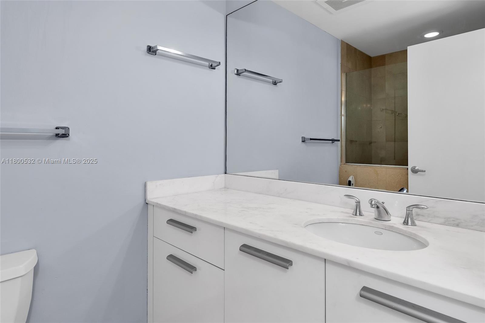 1060 Brickell Avenue, Unit 1811 Miami, FL 33131 - Photo 25 of 43 a bathroom with a sink and a toilet