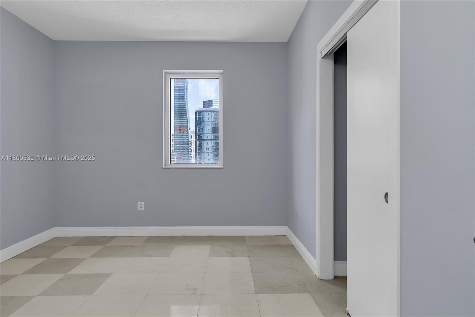 1060 Brickell Avenue, Unit 1811 Miami, FL 33131 - Photo 29 of 43 a view of a small space with wooden floor and a window
