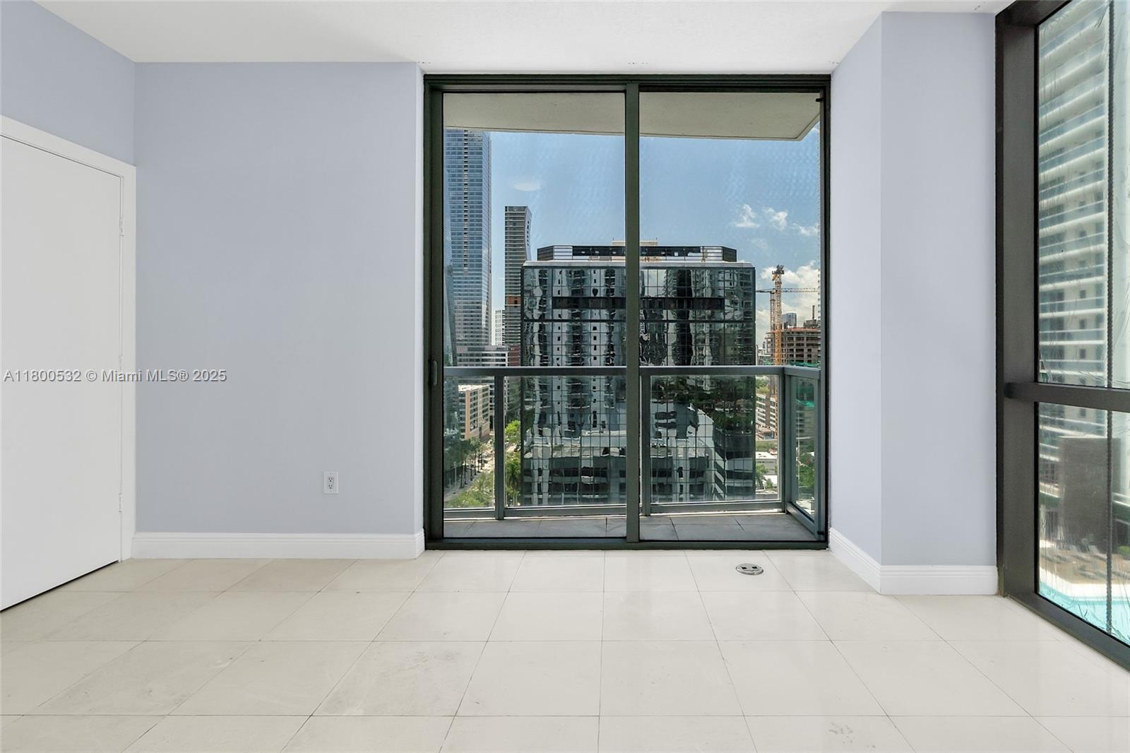 1060 Brickell Avenue, Unit 1811 Miami, FL 33131 - Photo 3 of 43 a view of a window with a glass door