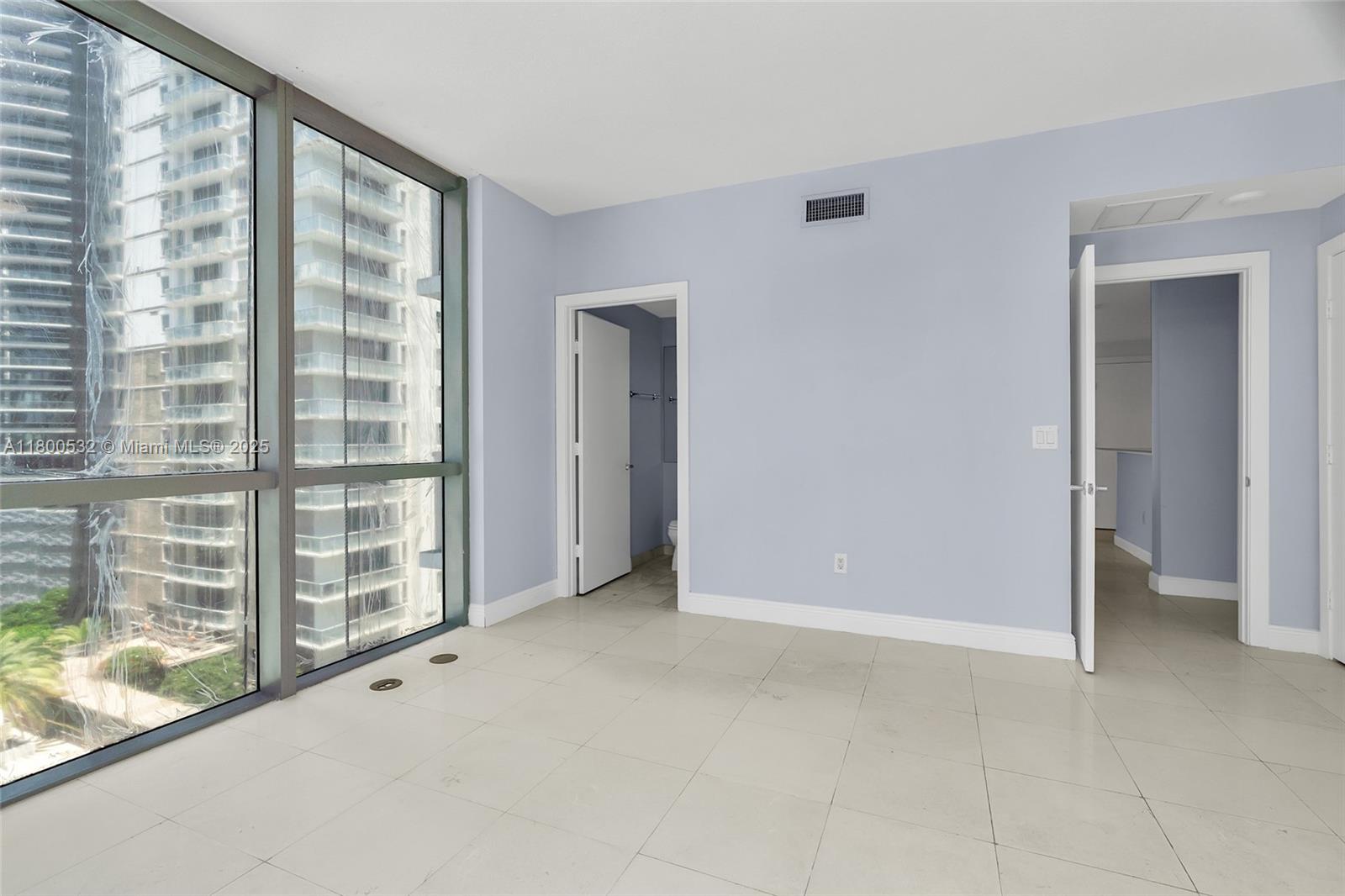 1060 Brickell Avenue, Unit 1811 Miami, FL 33131 - Photo 32 of 43 a view of an empty room with a window