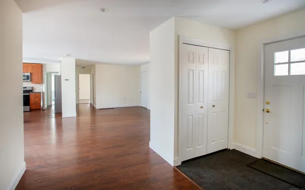 a view of a livingroom with wooden floor
