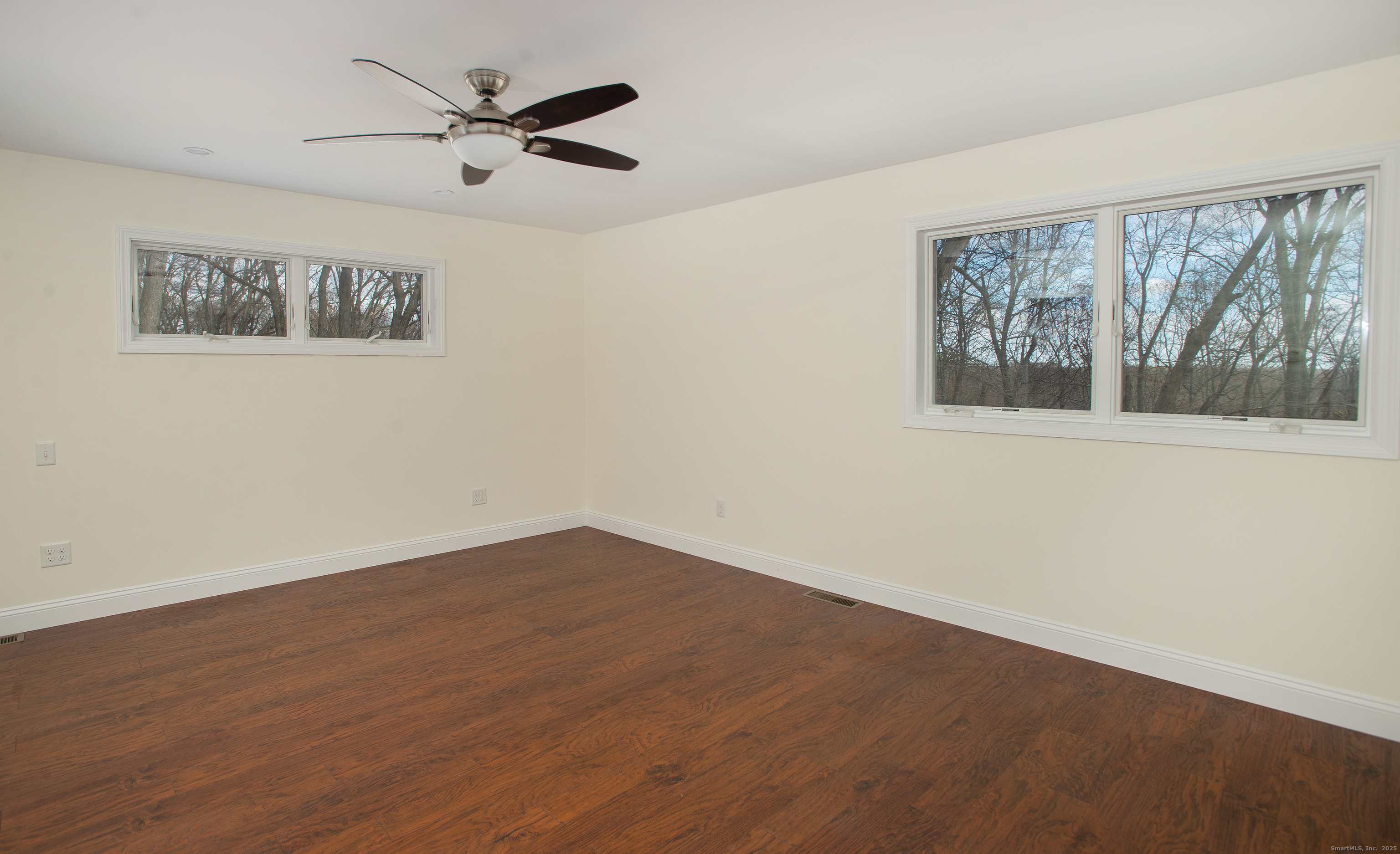 180 Peaceable Ridge Road Ridgefield, CT 06877 - Photo 14 of 28 wooden floor in an empty room with a window