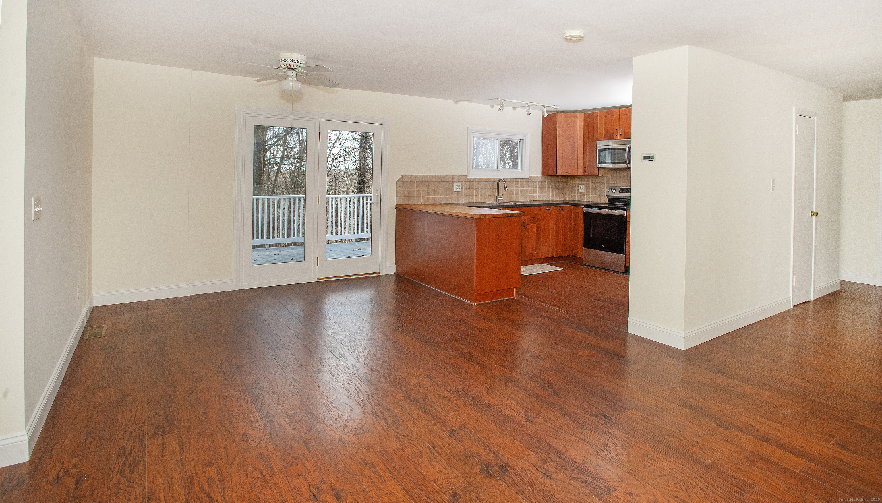 180 Peaceable Ridge Road Ridgefield, CT 06877 - Photo 14 of 28 a view of kitchen with stainless steel appliances granite countertop a stove top oven a sink with wooden floors