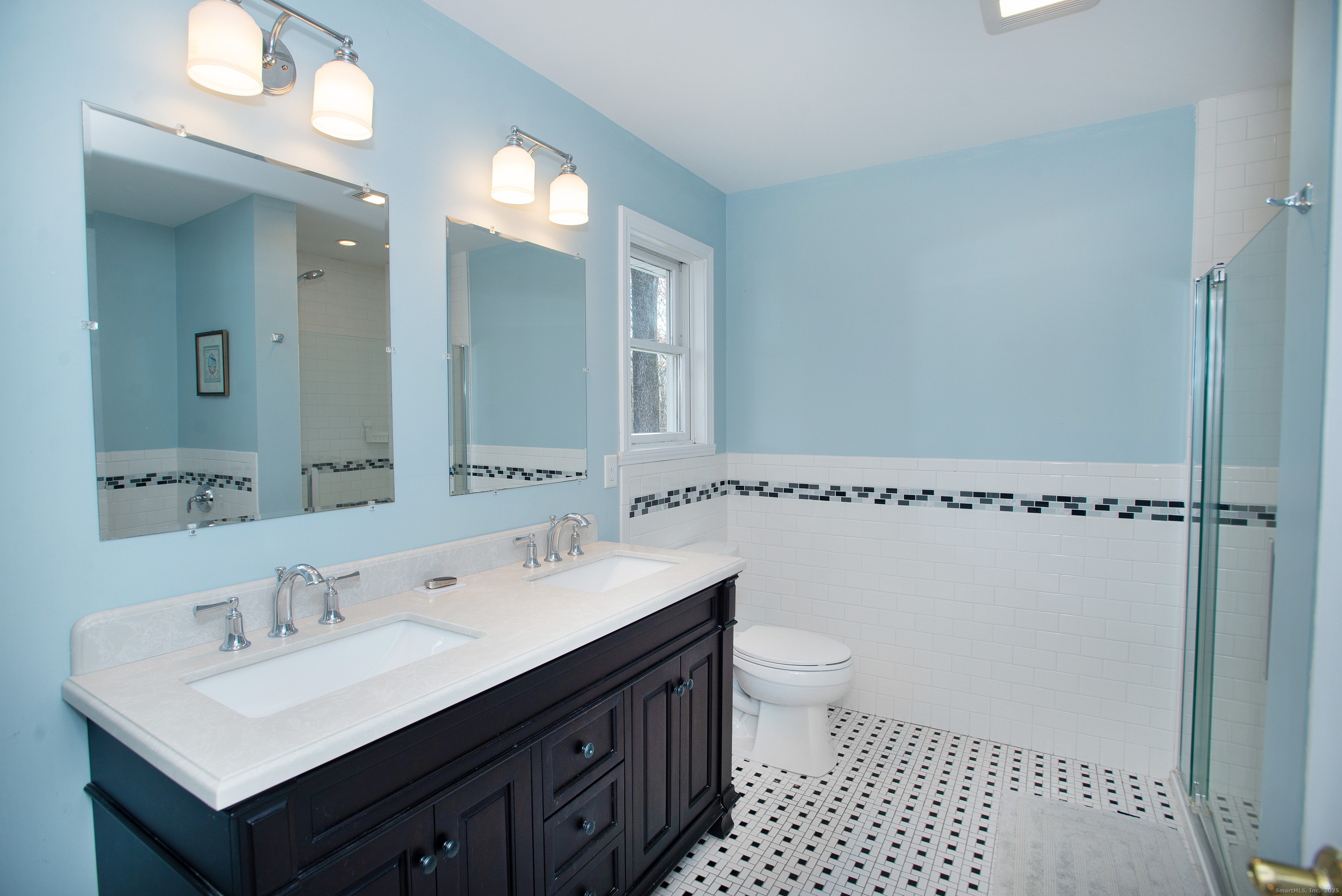 180 Peaceable Ridge Road Ridgefield, CT 06877 - Photo 16 of 28 a bathroom with a sink a toilet a mirror and shower